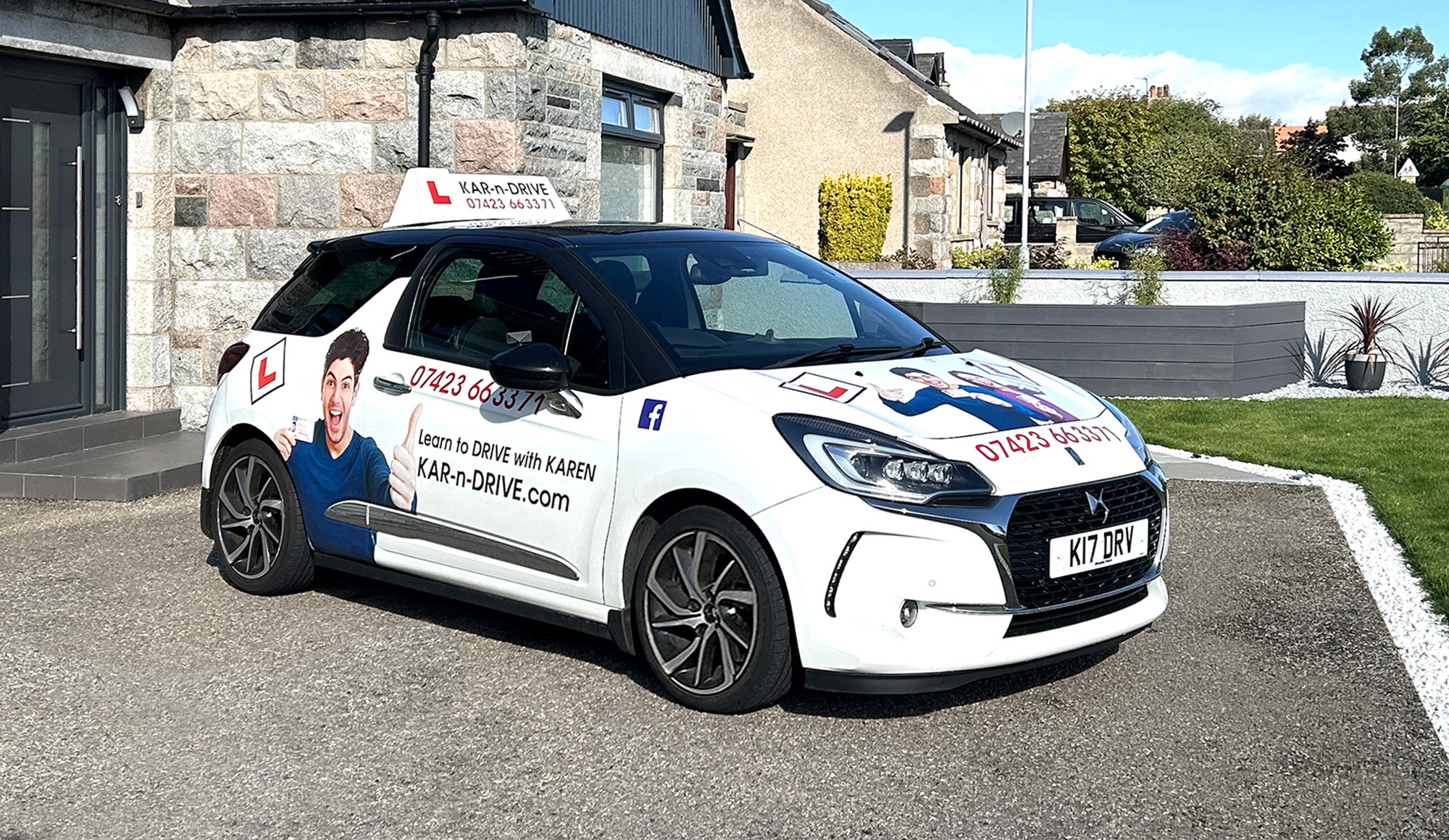 front and driver's side view of the driving school car