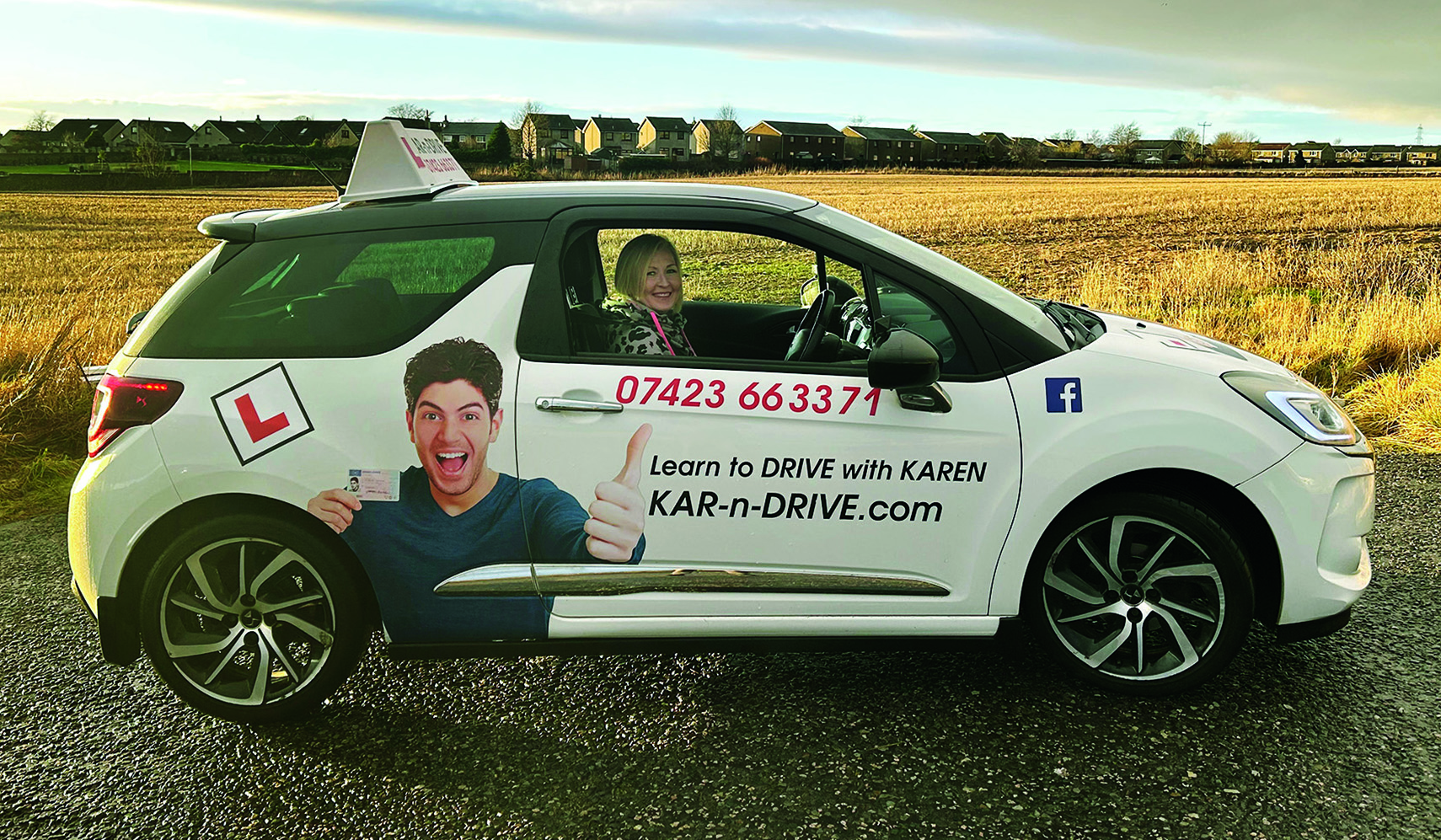 Karen pictured in the driving school car