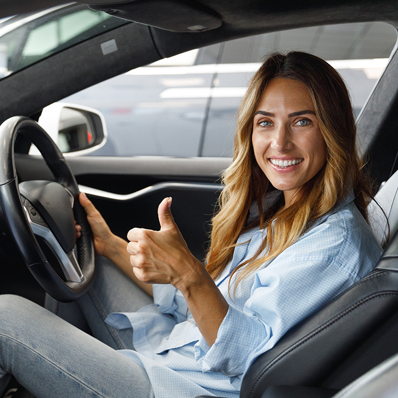 female pupil gaving the thumbs up